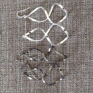 NWOT 2 pairs of unusual twisty earrning, one pair silver and one pair black